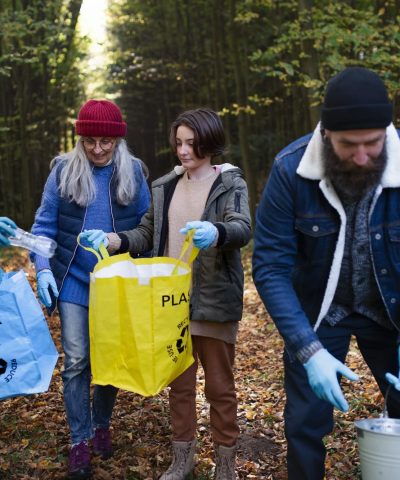 diverse-group-of-volunteers-cleaning-up-forest-from-waste-community-service-concept.jpg